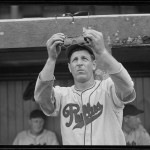 Philadelphia Phillies player examines his glasses